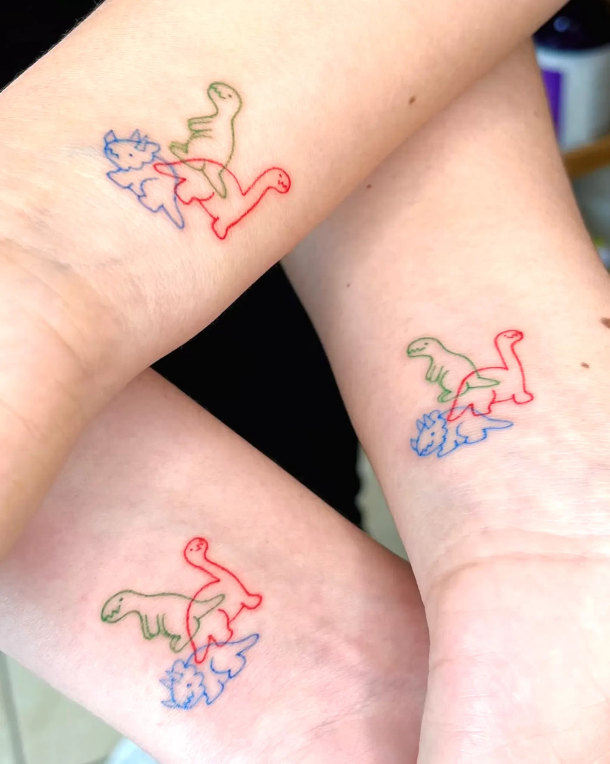 pastel fine line tattoos